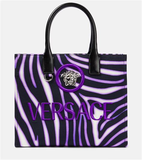 versace medusa bag purple|Versace Medusa clutch bag.